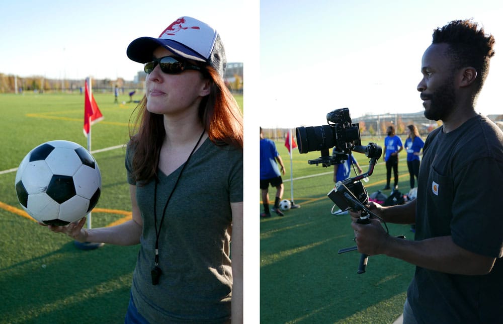 Woman holding a soccer ball and man holding a video camera.